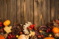 Harvest or Thanksgiving background with autumnal fruits and gourds on rustic wooden table Royalty Free Stock Photo