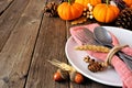Harvest or thanksgiving table setting close up against a rustic wood background Royalty Free Stock Photo
