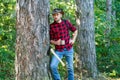 Harvest of timber. Bearded man with axe concept. Deforestation. Handsome Woodworkers lumberjack plaid shirt holding the Royalty Free Stock Photo