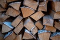 Harvested birch firewood is stacked in a neat woodpile Royalty Free Stock Photo