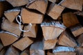 Harvested birch firewood is stacked in a neat woodpile Royalty Free Stock Photo