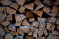 Harvested birch firewood is stacked in a neat woodpile Royalty Free Stock Photo
