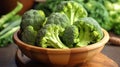 Harvested broccoli florets in wooden bowl