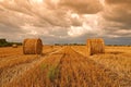 Harvested field with straw bales in summer Royalty Free Stock Photo