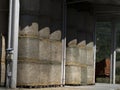 Harvested hay ball in the shed in summer Royalty Free Stock Photo