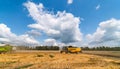 Harvester combine harvesting wheat on agricultural field on sunny summer day. Royalty Free Stock Photo