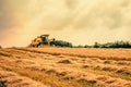 Harvester on a dry field Royalty Free Stock Photo