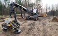 Harvester felling head detail. Forestry vehicle in off road