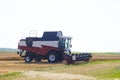 Harvester machine to harvest wheat field working. Combine agriculture harvesting golden ripe . Royalty Free Stock Photo