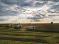 Harvester machine working in field . Combine harvester agriculture machine harvesting golden ripe wheat field Royalty Free Stock Photo