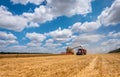 Harvester unloading grain.