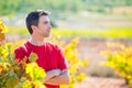 Harvester winemaker farmer proud of his vineyard