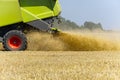 Harvester in work at summer hot day , blured - out of focus. Royalty Free Stock Photo