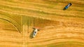 Harvester working in field and mows wheat. Ukraine. Aerial view. Royalty Free Stock Photo