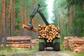 The harvester working in a forest. Royalty Free Stock Photo