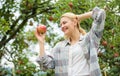 Harvesting apples from fruit tree. spring harvest. summer fruit. Happy woman eating apple. healthy teeth. hunger Royalty Free Stock Photo