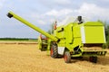 Harvesting combine on farmland