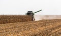 Harvesting of corn field with combine Royalty Free Stock Photo