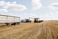 Harvesting a crop field on the prairie Royalty Free Stock Photo