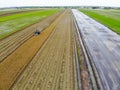 Harvesting farm, Harvester machinery in field.