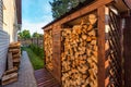 Harvesting firewood for the winter near wooden village vacation home