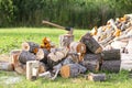 Chopped firewood and wooden axe Royalty Free Stock Photo