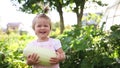 Harvesting in garden. happy child holds vegetable squash. first baby food. low allergenic product.