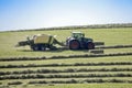 Harvesting hay traktor work on field