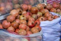 Harvesting pomegranates in bags. I buy red pomegranates at the local farmer's market. Royalty Free Stock Photo