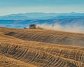 Harvesting Rolling Hills of Wheat in Central Oregon Royalty Free Stock Photo