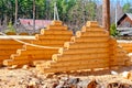 Harvesting roof for log houses from round timber Royalty Free Stock Photo