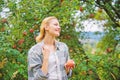 Harvesting season concept. Woman hold apple garden background. Farm produce organic natural product. Girl rustic style