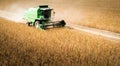 Harvesting of soy bean field with combine Royalty Free Stock Photo