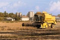 Harvesting of soybean field with combine harvester. Royalty Free Stock Photo