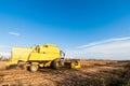 Harvesting of soybean field with combine harvester. Royalty Free Stock Photo