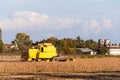 Harvesting of soybean field with combine harvester. Royalty Free Stock Photo