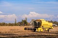 Harvesting of soybean field with combine harvester. Royalty Free Stock Photo