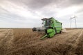 Agricultural machine harvesting soybean field Royalty Free Stock Photo