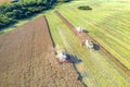 Agriculture. Agricultural industry. Aerial view of combine harvesters harvest field