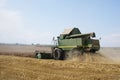 Harvesting wheat in autumn field