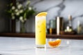 harvey wallbanger in tall glass, orange slice