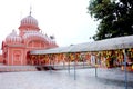 A rural village landscape consisting of lush greenery, a Hindu temple