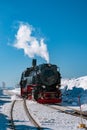 Harz national park Germany, Steam train on the way to Brocken through winter landscape, Famous steam train throught the