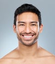 He has a fantastic self-image. a handsome young man posing against a grey background.