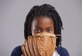 He has his eye on the ball. Studio shot of a young boy with baseball gear. Royalty Free Stock Photo