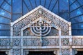 Menorah above the doors of synagogue Royalty Free Stock Photo