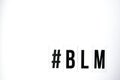 Hashtag BLM BLACK LIVES MATTER text on a white background. Protest against the end of racism, anti-racism, equality