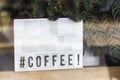 Hashtag Coffee Signboard Seen Through Window Royalty Free Stock Photo