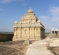 Hassan, Karnataka, India - September 12, 2009 Ancient Jain temple with ornate tower on top of mountain