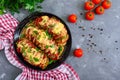 Hasselback potato stuffed with salami, cheese, ketchup, garlic and herbs. Baked whole potatoes is sliced and stuffed. Traditional